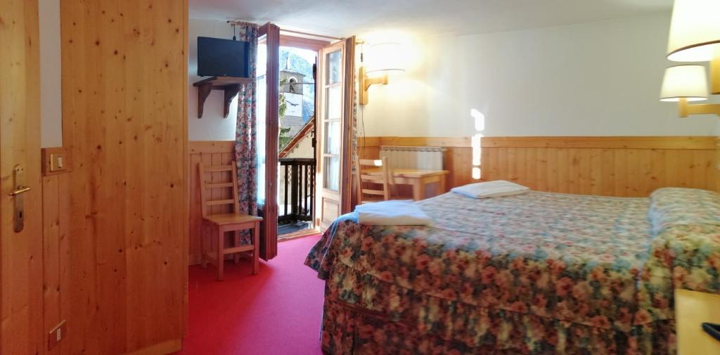 Postel nebo postele na pokoji v ubytování Hotel Locanda Grauson