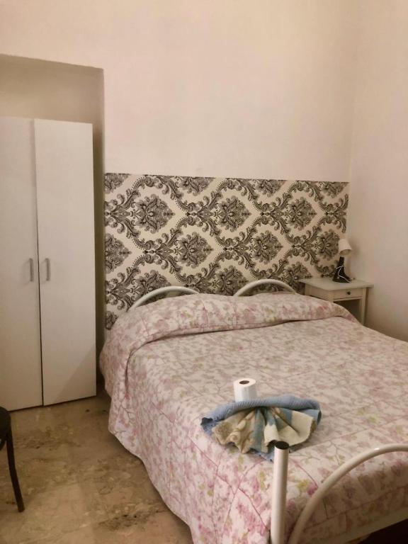 Postel nebo postele na pokoji v ubytování Il balcone sullo Stretto
