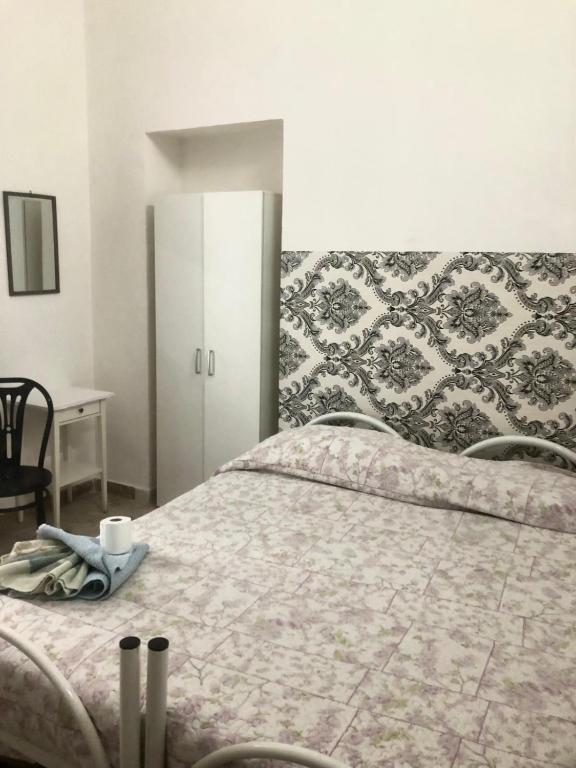 Postel nebo postele na pokoji v ubytování Il balcone sullo Stretto