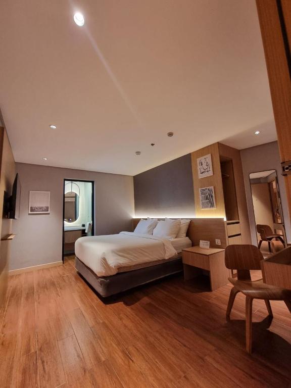 Postel nebo postele na pokoji v ubytování Moonstar Cebu Hotel