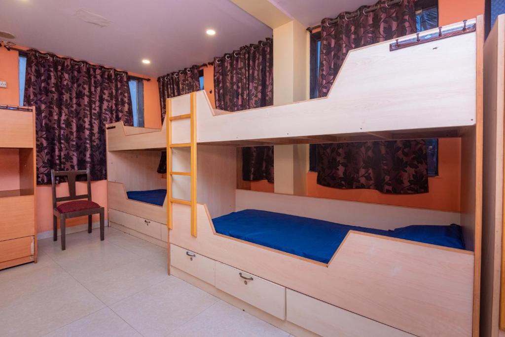 Postel nebo postele na pokoji v ubytování HOTEL AVISHA Residency