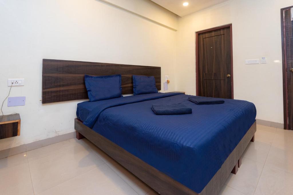 Postel nebo postele na pokoji v ubytování HOTEL AVISHA Residency