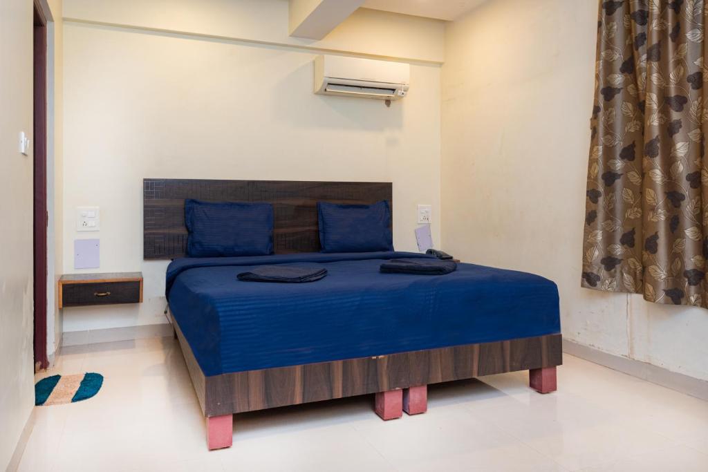 Postel nebo postele na pokoji v ubytování HOTEL AVISHA Residency