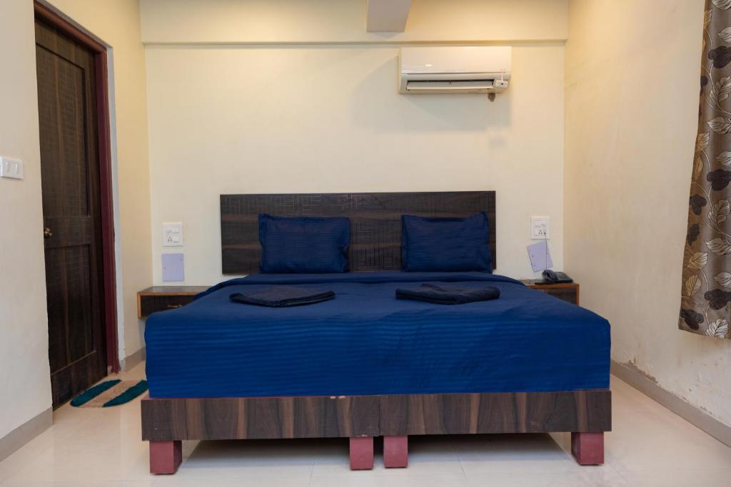Postel nebo postele na pokoji v ubytování HOTEL AVISHA Residency