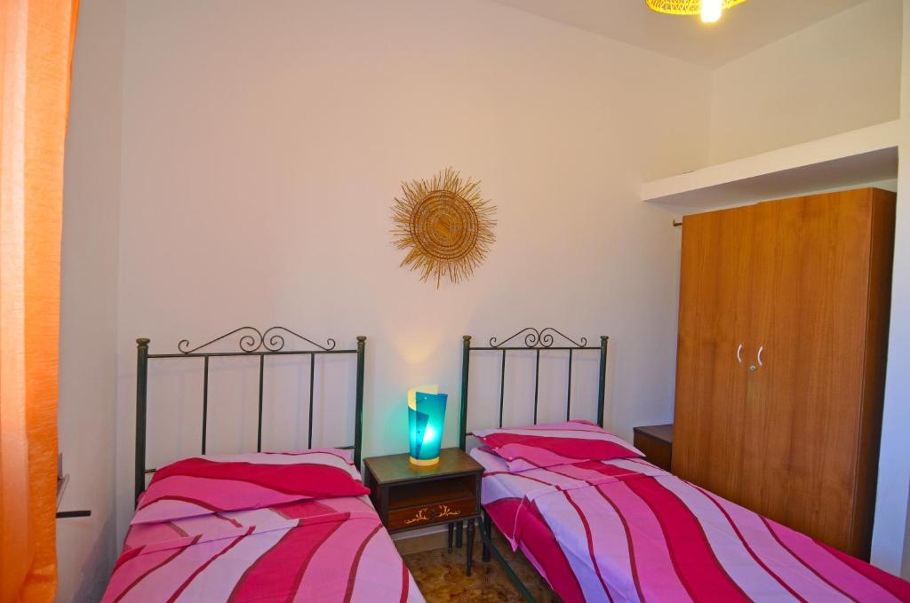 Postel nebo postele na pokoji v ubytování Casa Orizzonte