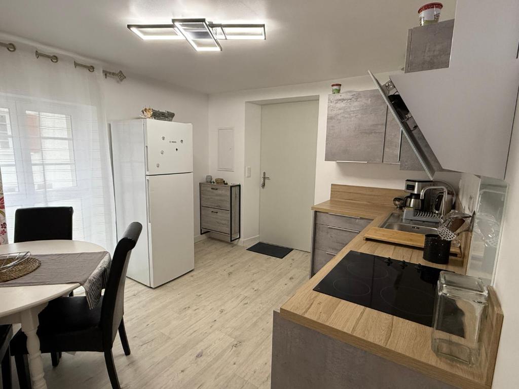 Kuchyň nebo kuchyňský kout v ubytování Comme à la maison