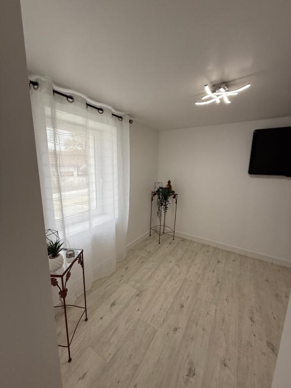 TV a/nebo společenská místnost v ubytování Comme à la maison