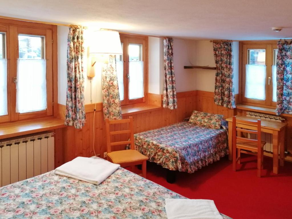 Postel nebo postele na pokoji v ubytování Hotel Locanda Grauson