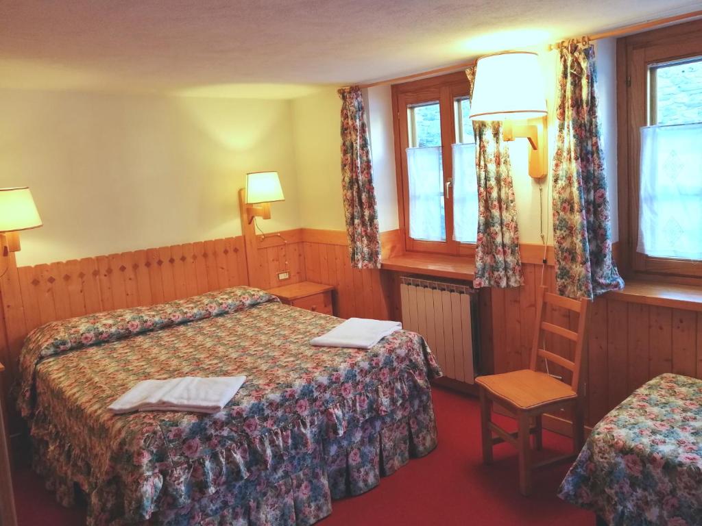 Postel nebo postele na pokoji v ubytování Hotel Locanda Grauson