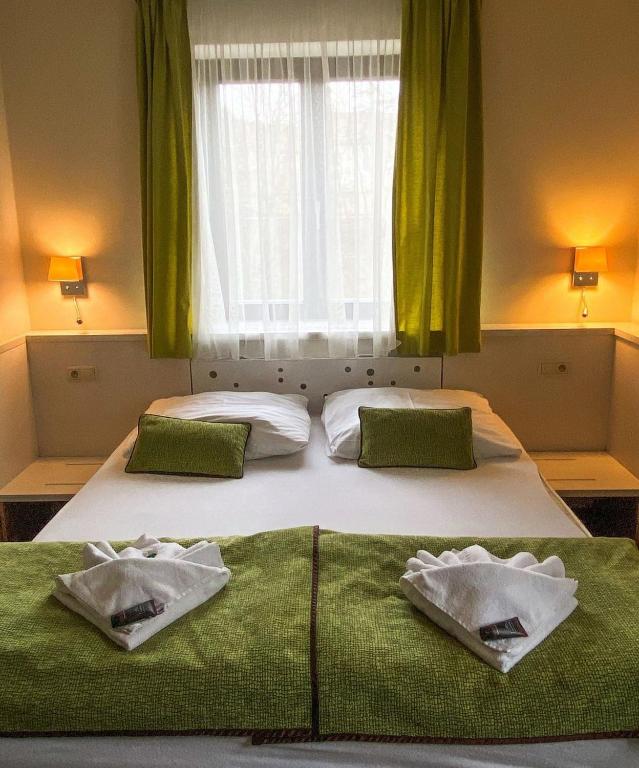 Postel nebo postele na pokoji v ubytování Hotel Olberg