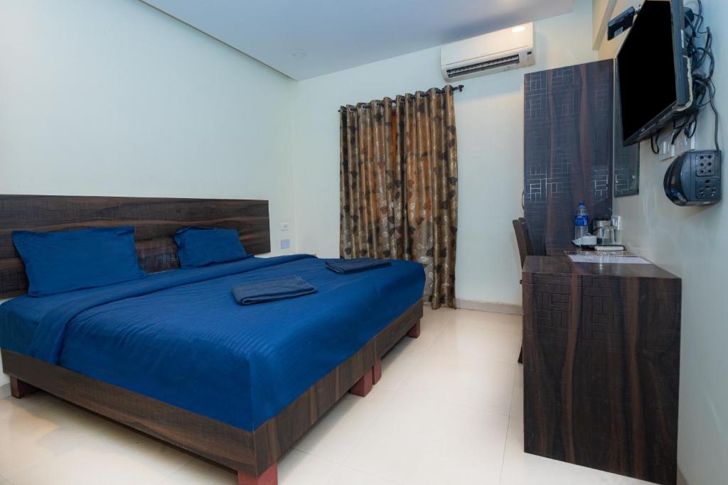 Postel nebo postele na pokoji v ubytování HOTEL AVISHA Residency