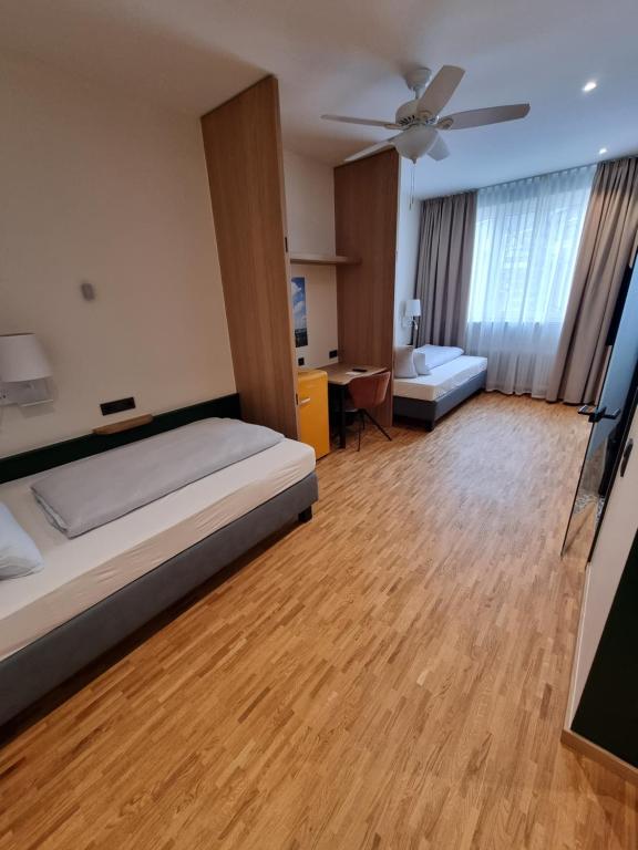 Postel nebo postele na pokoji v ubytování myMINGA13 - Hotel & serviced Apartments
