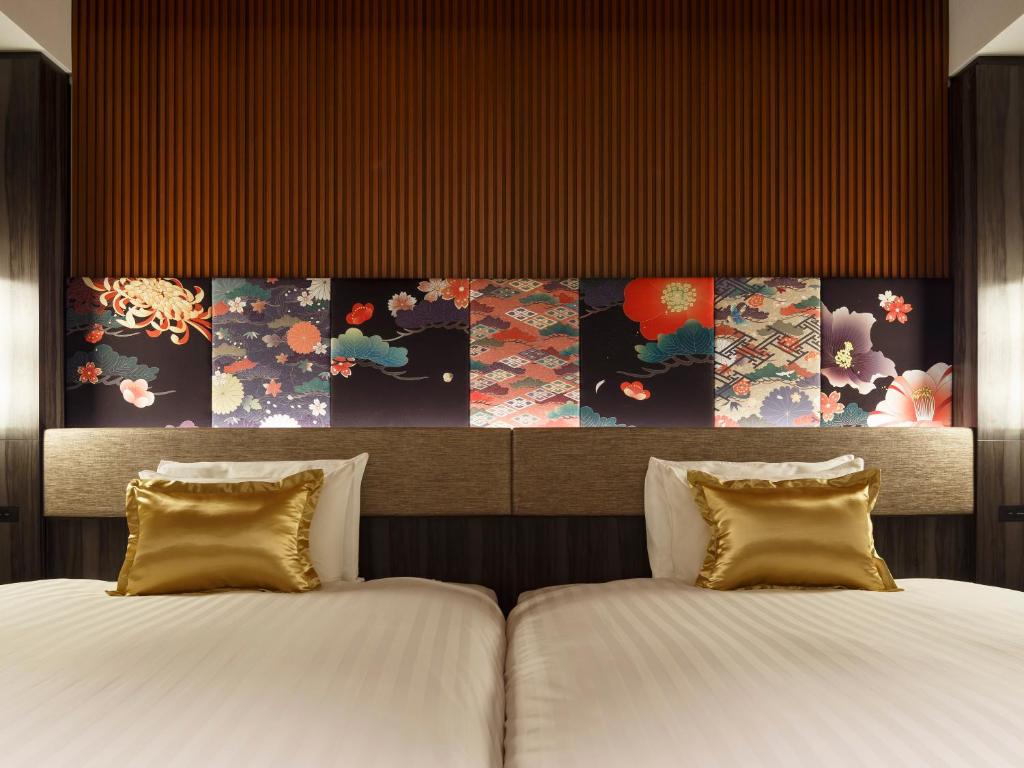 Postel nebo postele na pokoji v ubytování Mitsui Garden Hotel Kanazawa