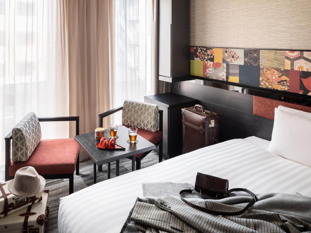 Postel nebo postele na pokoji v ubytování Mitsui Garden Hotel Kanazawa