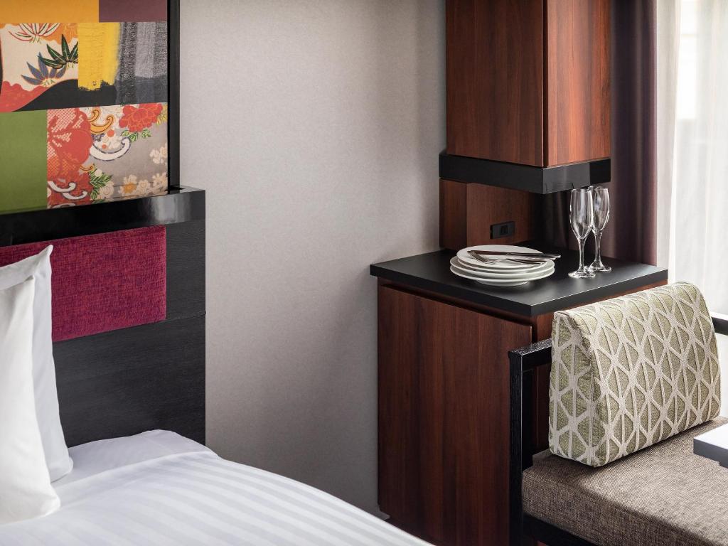 Postel nebo postele na pokoji v ubytování Mitsui Garden Hotel Kanazawa