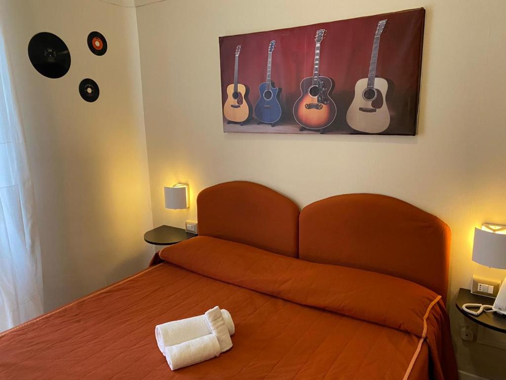 Llit o llits en una habitació de Hotel Morandi