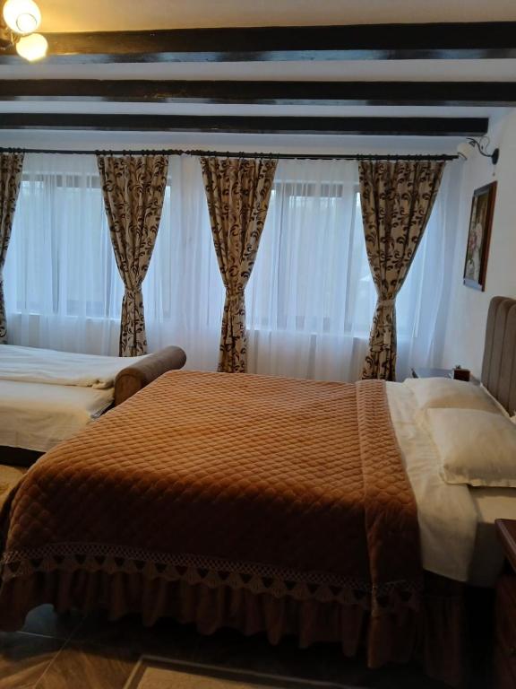 Postel nebo postele na pokoji v ubytování Casa Roșca