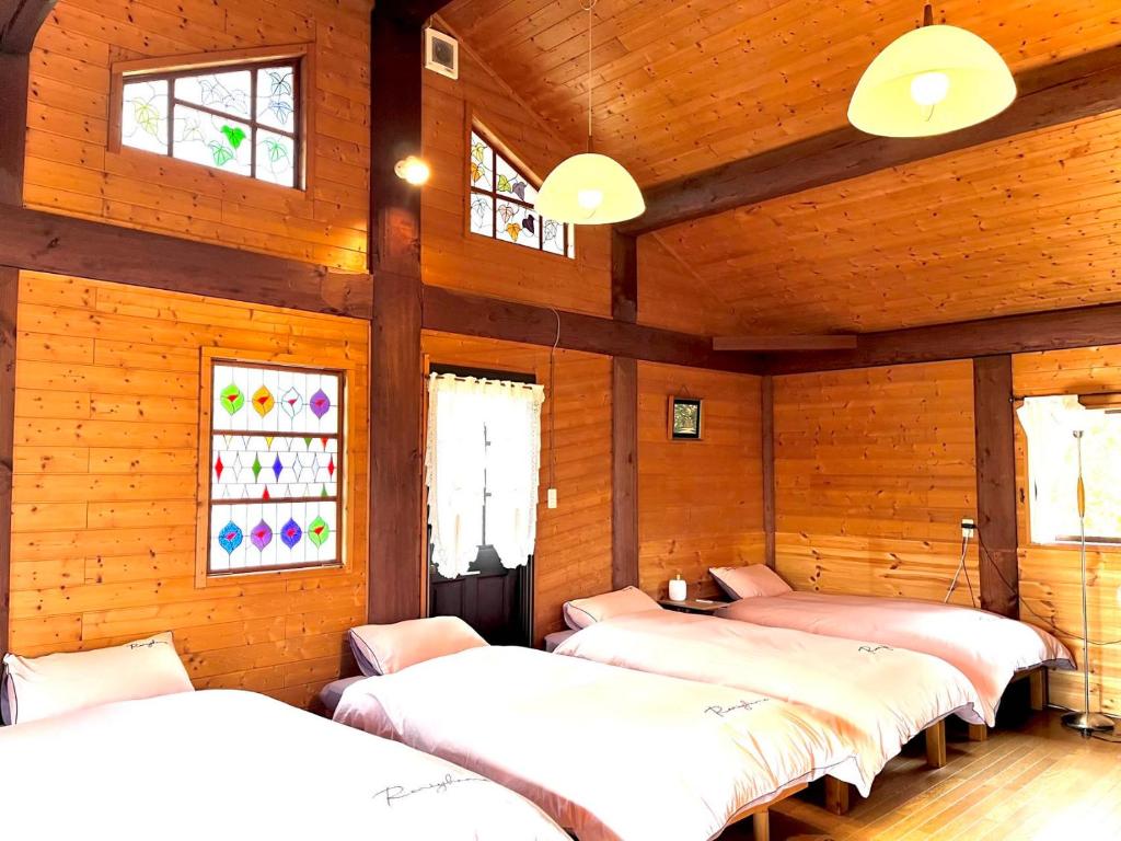 Postel nebo postele na pokoji v ubytování beau lac biwako