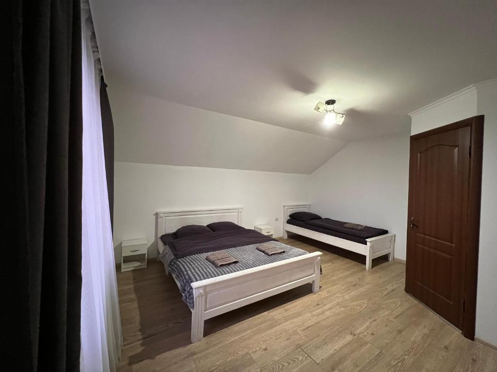 Postel nebo postele na pokoji v ubytování Harmony
