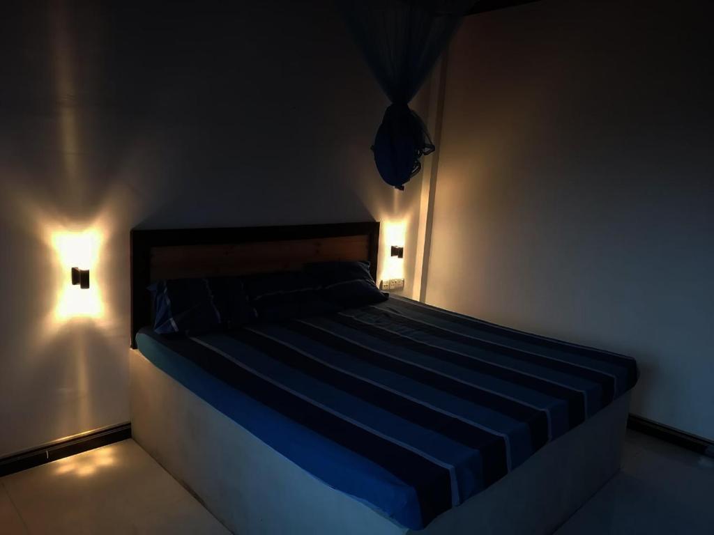 Postel nebo postele na pokoji v ubytování ARI Paradise