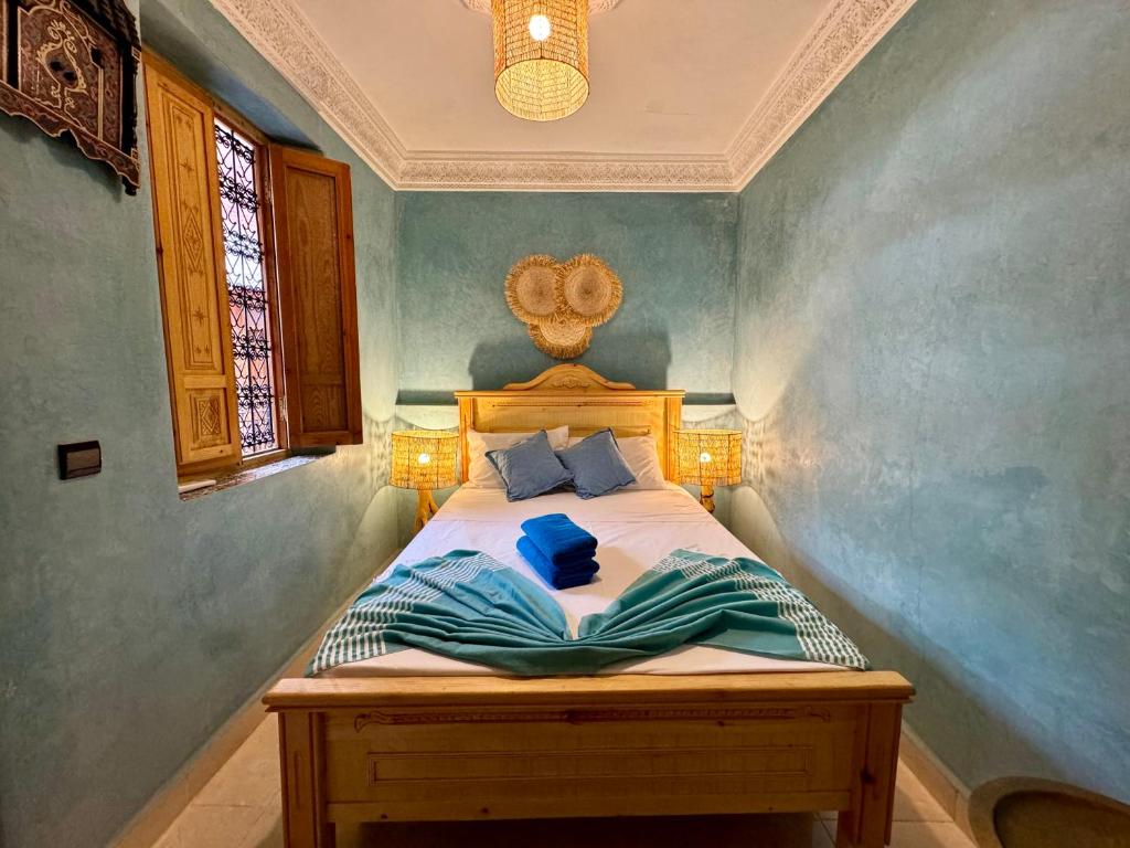 Postel nebo postele na pokoji v ubytování Riad Flottement Des Songes