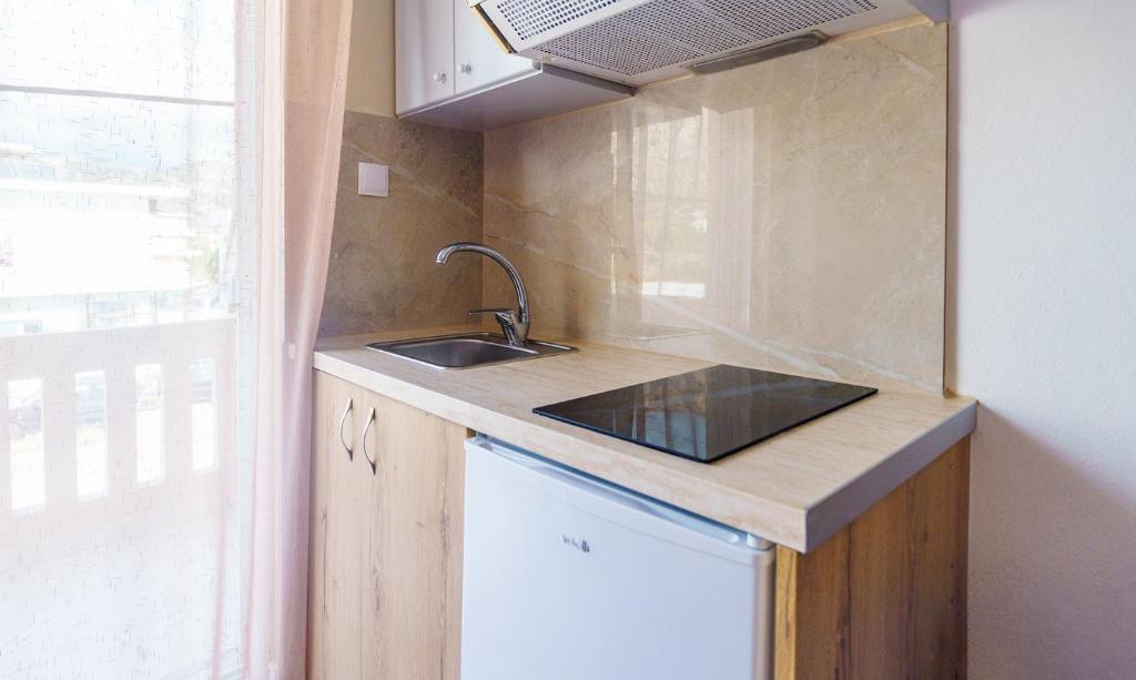Kuchyňa alebo kuchynka v ubytovaní Nikos Rooms