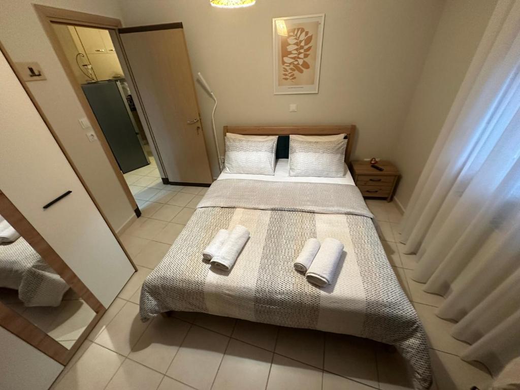a bedroom with two beds with towels on it at ELIA Guesthouse in Komotini