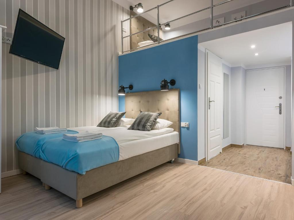 Cama o camas de una habitación en Loretańska Apartments 6