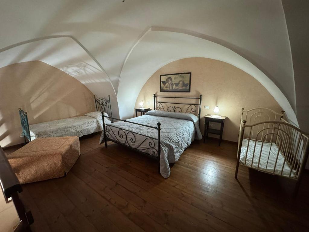 Postel nebo postele na pokoji v ubytování B&B La Corte