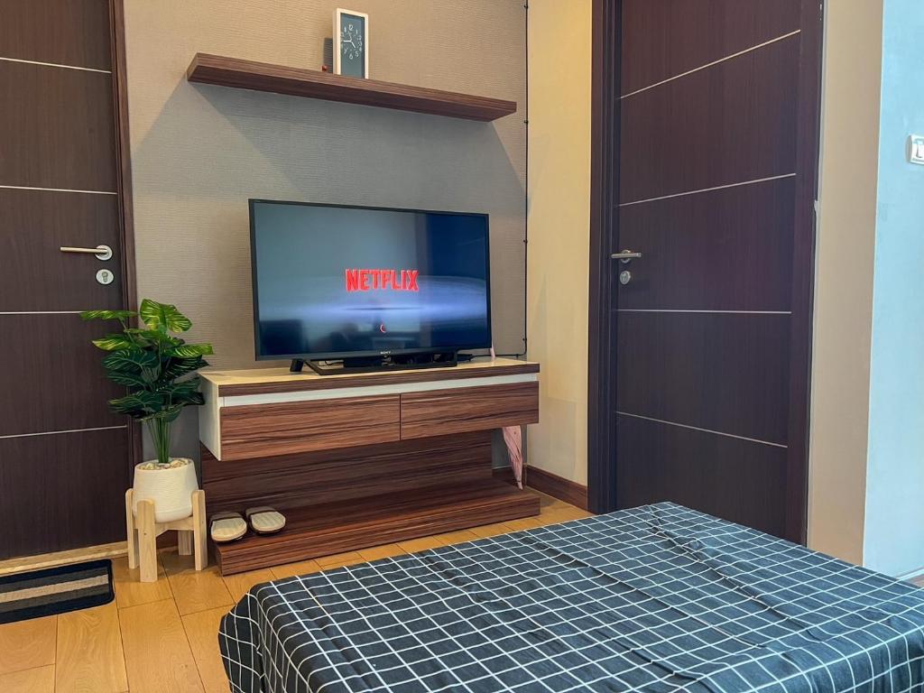 TV a/nebo společenská místnost v ubytování The Astra Luxury Condo in Town