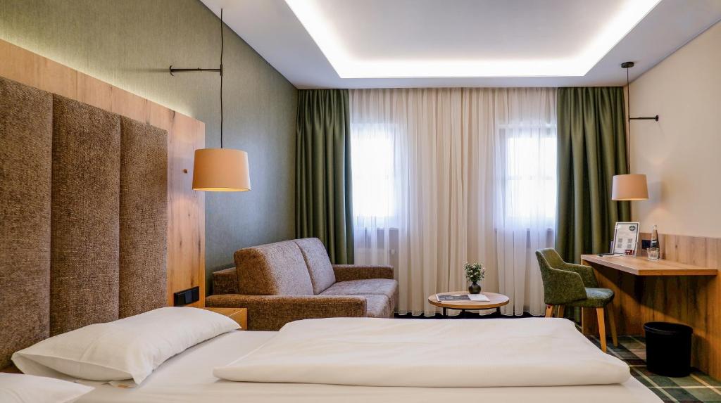 Postel nebo postele na pokoji v ubytování Hotel Restaurant Erber