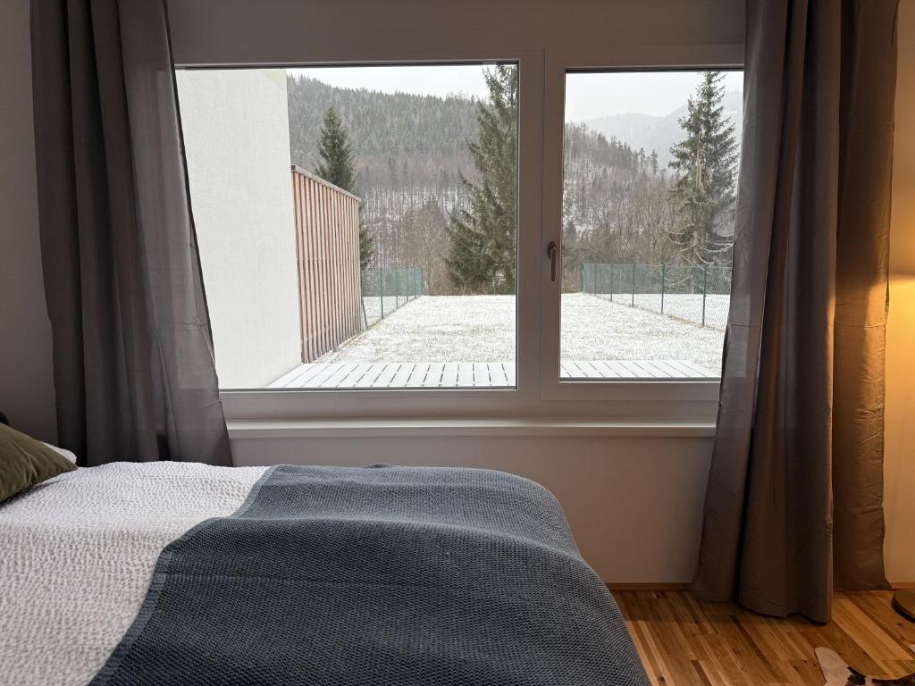 Postel nebo postele na pokoji v ubytování Bergzauber am Semmering