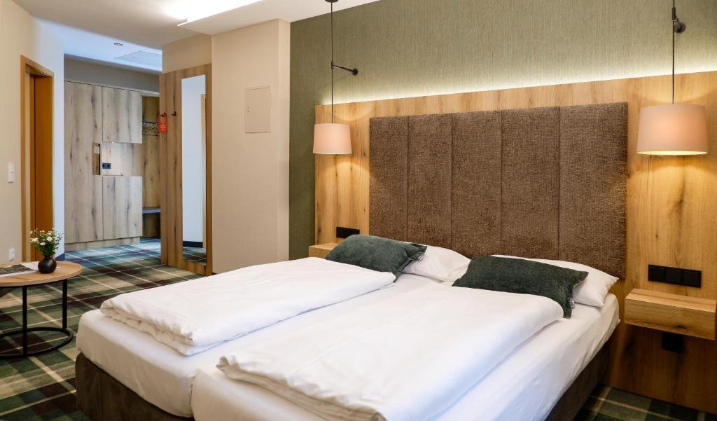 Postel nebo postele na pokoji v ubytování Hotel Restaurant Erber