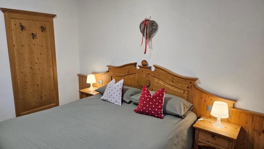 Postel nebo postele na pokoji v ubytování Appartamenti Croz del Re