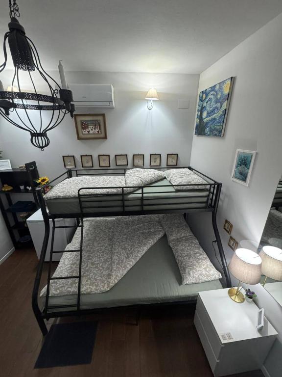 Postel nebo postele na pokoji v ubytování Palazzo Adalgisa