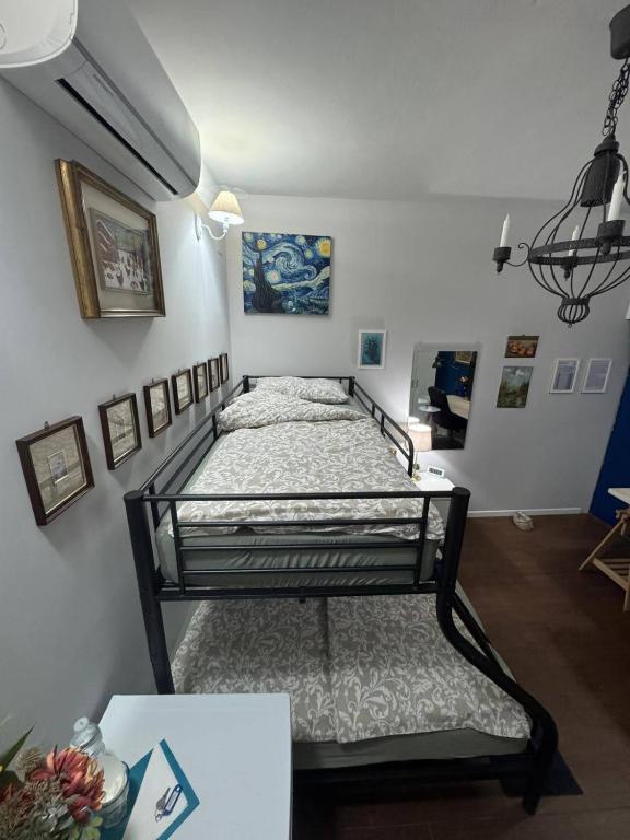 Postel nebo postele na pokoji v ubytování Palazzo Adalgisa
