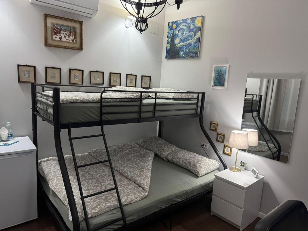 Postel nebo postele na pokoji v ubytování Palazzo Adalgisa