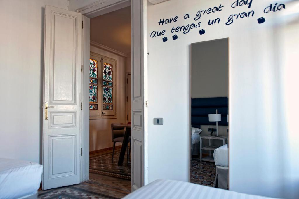 A bed or beds in a room at MH Apartments Tetuan
