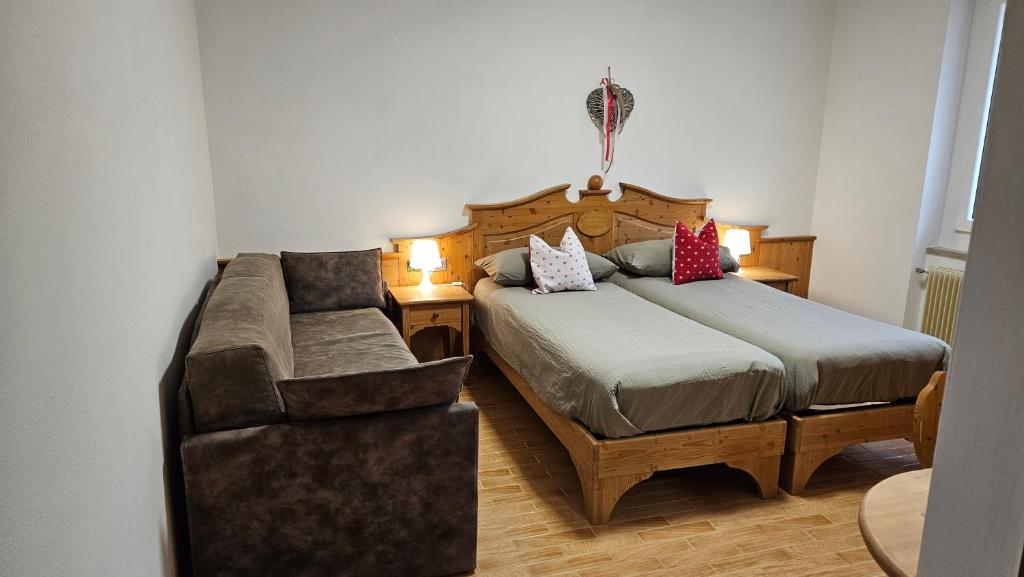 Postel nebo postele na pokoji v ubytování Appartamenti Croz del Re