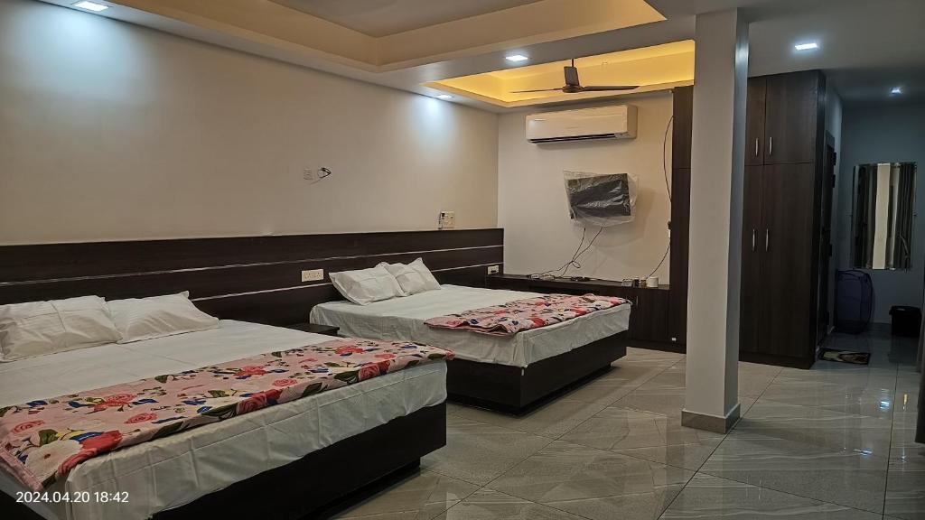 Postel nebo postele na pokoji v ubytování Aroma Serviced Villa Cochin