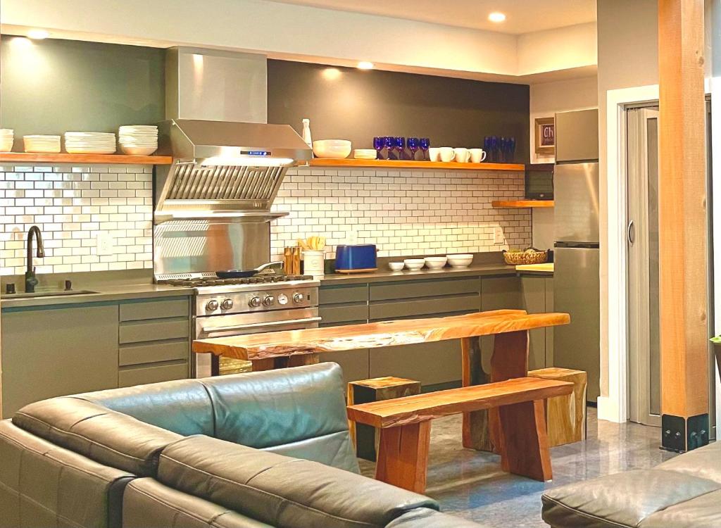 a kitchen with a couch and a table in it at Petaluma Warehouse Lofts unit E in Petaluma