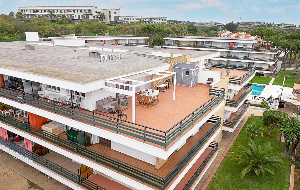 an aerial view of a building with a pool at Awesome Apartment In El Rompido in El Rompido