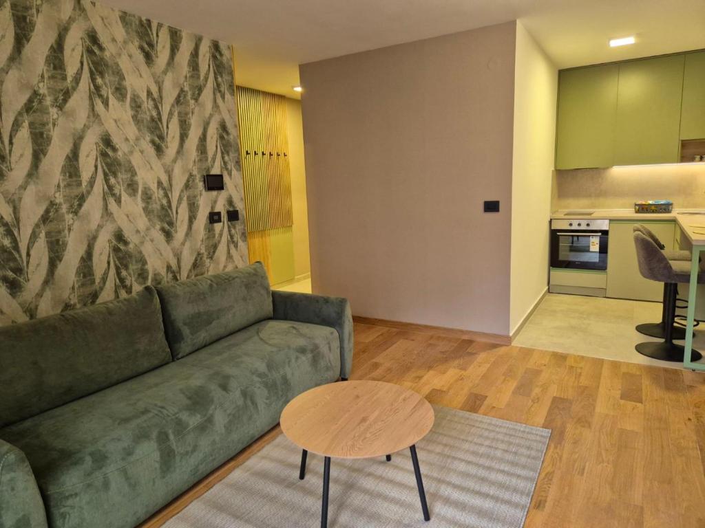 a living room with a couch and a table at Sajam 2 in Novi Sad