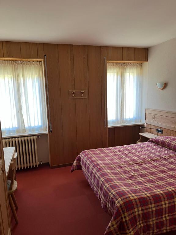 Postel nebo postele na pokoji v ubytování Albergo Piazzatorre