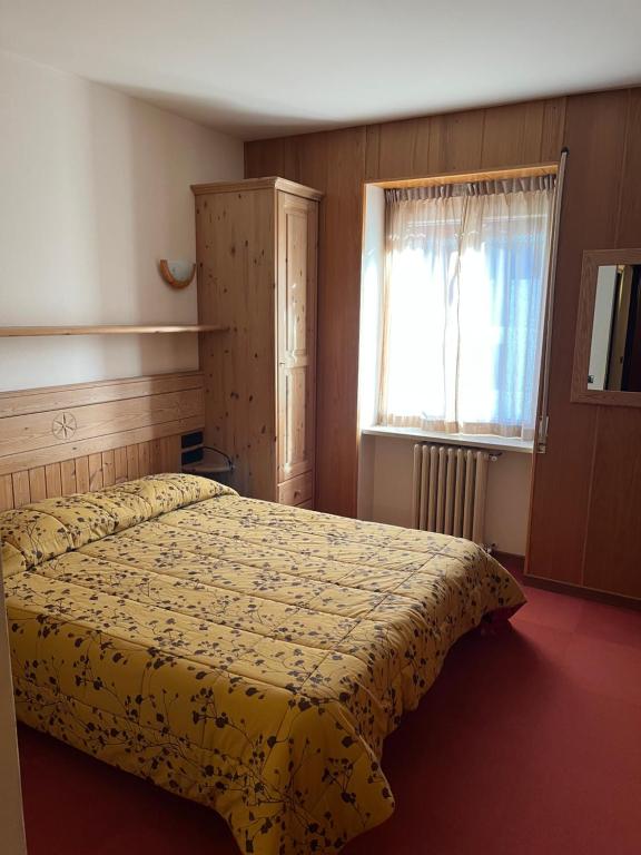 Postel nebo postele na pokoji v ubytování Albergo Piazzatorre