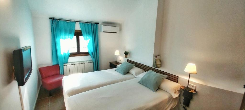 Postel nebo postele na pokoji v ubytování Casa Rural, Spa y restaurante El Huerto del Abuelo