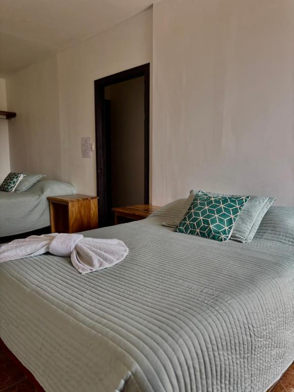 Postel nebo postele na pokoji v ubytování Monteverde Ecolodge