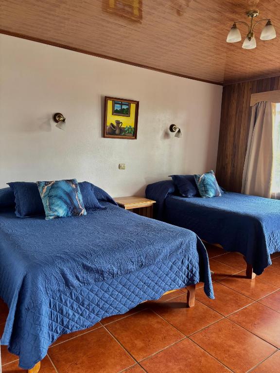 Postel nebo postele na pokoji v ubytování Monteverde Ecolodge