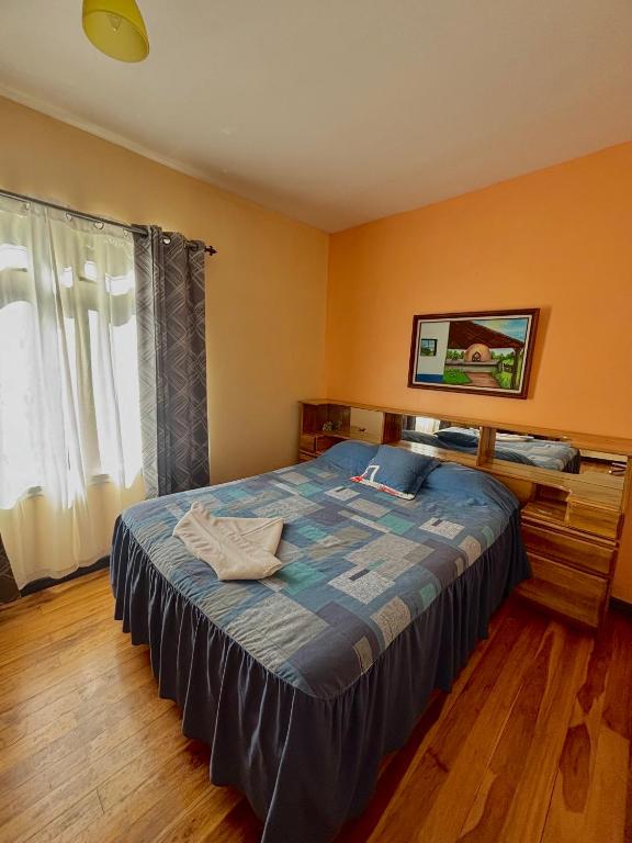 Postel nebo postele na pokoji v ubytování Monteverde Ecolodge