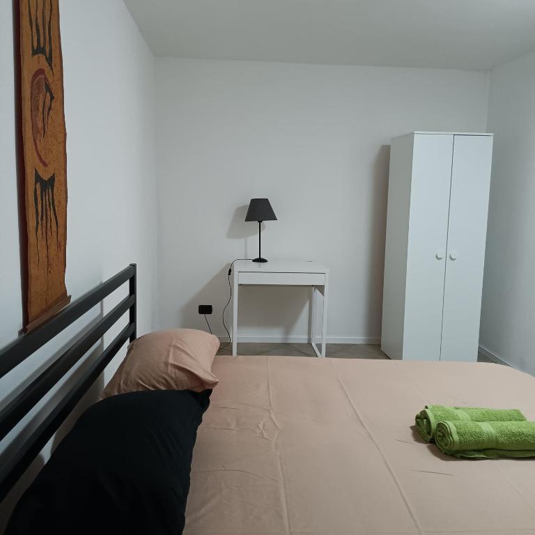Postel nebo postele na pokoji v ubytování Alloggio Le Palme